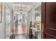 Stylish entryway with black tiled floor, decorative table, and partial view of the living area at 3286 Northside Nw Pkwy # 304, Atlanta, GA 30327