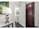 Hallway with an open bathroom and black tiled floors at 3286 Northside Nw Pkwy # 304, Atlanta, GA 30327