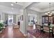 Open-concept living room featuring hardwood floors, stylish furniture, and abundant natural light at 3286 Northside Nw Pkwy # 304, Atlanta, GA 30327