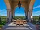 Picturesque outdoor patio with a wooden dining set surrounded by an arched colonnade and beautiful views at 3286 Northside Nw Pkwy # 304, Atlanta, GA 30327