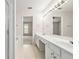 Bright bathroom featuring a double sink vanity and separate tub at 3600 Elkhorn Nw Ct, Duluth, GA 30096