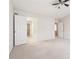 Spacious bedroom featuring neutral carpet, a ceiling fan, and ensuite access at 3600 Elkhorn Nw Ct, Duluth, GA 30096