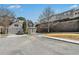 View of multiple homes with a two-car garage and landscaping. Located in a tranquil suburban neighborhood at 3600 Elkhorn Nw Ct, Duluth, GA 30096