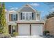 Charming two-story home with brick and gray siding and a two-car garage in a well-maintained community at 3600 Elkhorn Nw Ct, Duluth, GA 30096
