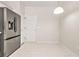 An eat-in kitchen featuring tile floors, a modern stainless steel refrigerator, and a light-filled eating area at 3600 Elkhorn Nw Ct, Duluth, GA 30096
