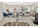 Bright kitchen open to the dining and living areas, featuring an island with granite countertop at 1326 Magnolia Bend Way # 304, Jonesboro, GA 30238