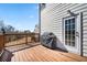 Wooden deck, BBQ grill, and backyard access provide a perfect outdoor space to enjoy the view and grill at 3658 Chattahoochee Summit Dr, Atlanta, GA 30339