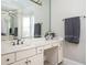 Bathroom vanity with a large mirror, granite countertop, and great storage with a bay window at 4349 Highborne Ne Dr, Marietta, GA 30066