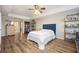 Spacious bedroom boasting hard floors, neutral paint, a tray ceiling, and decorative shelving at 4349 Highborne Ne Dr, Marietta, GA 30066