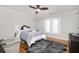 Cozy bedroom with hardwood floors, ceiling fan, and bright natural light at 4349 Highborne Ne Dr, Marietta, GA 30066