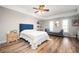 Large bedroom highlighting hard floors, neutral paint, tray ceiling, and picture frame windows at 4349 Highborne Ne Dr, Marietta, GA 30066