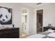 Cozy bedroom featuring a panda art piece, dresser, and ensuite bathroom for added convenience at 4349 Highborne Ne Dr, Marietta, GA 30066