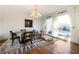 Bright dining room featuring large windows, a chandelier, and modern decor at 4349 Highborne Ne Dr, Marietta, GA 30066