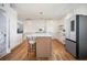Modern kitchen with white cabinets, stainless steel appliances, and an island with seating at 4349 Highborne Ne Dr, Marietta, GA 30066