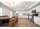 Bright kitchen features white cabinets, stainless steel appliances, and an eat-in area with wooden benches at 4349 Highborne Ne Dr, Marietta, GA 30066
