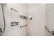Contemporary shower features a built-in shower niche and grab bars for safety at 4349 Highborne Ne Dr, Marietta, GA 30066