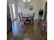 Cozy dining room features wood flooring, dining table with seating, and bright natural lighting at 4906 Kellys Mill Nw Dr, Lilburn, GA 30047