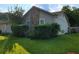 Charming single-Gathering home featuring a stone facade and well-maintained lawn with mature landscaping and lots of shade at 4906 Kellys Mill Nw Dr, Lilburn, GA 30047