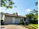 Charming home exterior with siding and a brick chimney at 4906 Kellys Mill Nw Dr, Lilburn, GA 30047