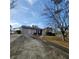 Charming single-story home with a well-maintained lawn and a long driveway at 4906 Kellys Mill Nw Dr, Lilburn, GA 30047