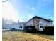 Charming home exterior features stone accents and a well-maintained front lawn under a bright sky at 4906 Kellys Mill Nw Dr, Lilburn, GA 30047