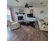 Cozy living room with stone fireplace, leather furniture, and decorative accents at 4906 Kellys Mill Nw Dr, Lilburn, GA 30047