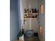 Small storage area with shelving unit, various household cleaning supplies, and a case of bottled water at 4906 Kellys Mill Nw Dr, Lilburn, GA 30047