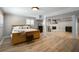 Finished basement features a large sleeping area, hardwood flooring and white painted support beams at 1923 Rugby Ave, Atlanta, GA 30337