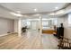 Finished basement features painted support beams, hardwood flooring and plenty of room at 1923 Rugby Ave, Atlanta, GA 30337