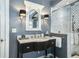 Bathroom with a vessel sink, elegant mirror, and a glass-enclosed shower at 1923 Rugby Ave, Atlanta, GA 30337