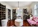 Spacious walk-in closet with custom shelving, chandelier, and plush seating at 1923 Rugby Ave, Atlanta, GA 30337