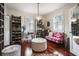 Bright, organized walk-in closet with ample storage, natural light, and a chic seating area at 1923 Rugby Ave, Atlanta, GA 30337