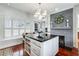Bright and airy kitchen featuring an island with granite countertop at 1923 Rugby Ave, Atlanta, GA 30337