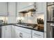 Modern kitchen featuring stainless steel appliances, a gas cooktop and white cabinets at 1923 Rugby Ave, Atlanta, GA 30337