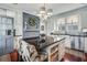 Spacious kitchen with large island featuring granite countertops and white cabinets at 1923 Rugby Ave, Atlanta, GA 30337