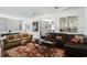 Open-concept living room with hardwood floors, a large window, and comfortable sofas and seating at 1923 Rugby Ave, Atlanta, GA 30337