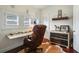 Bright home office with floating desk, white plantation shutters and unique decor at 1923 Rugby Ave, Atlanta, GA 30337