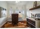 Inviting home office with a leather chair, built-in desk, and stylish decorative elements at 1923 Rugby Ave, Atlanta, GA 30337