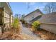 View of side yard showing lush landscaping and a gravel path at 1923 Rugby Ave, Atlanta, GA 30337