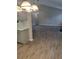 View of the kitchen and living room, with gray cabinets, white countertops, and modern ceiling lights at 2071 Boone Pl, Snellville, GA 30078