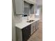Modern kitchen with stainless steel appliances, white countertops, and stylish gray cabinets at 2071 Boone Pl, Snellville, GA 30078