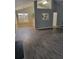 Spacious living room featuring updated hardwood flooring, vaulted ceilings, and view to the kitchen at 2071 Boone Pl, Snellville, GA 30078