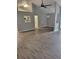 Open floor plan featuring spacious living area, tall ceilings, modern ceiling fan and hardwood flooring at 2071 Boone Pl, Snellville, GA 30078