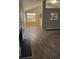 Open floor plan with living room and view to the kitchen featuring gray paint and hardwood floors at 2071 Boone Pl, Snellville, GA 30078