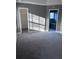 Bright bedroom with neutral carpet and doorways to bath and walk-in closet at 4415 Yates Rd, Atlanta, GA 30337