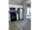 Kitchen with stainless steel appliances, ample counter space, and white cabinetry at 4415 Yates Rd, Atlanta, GA 30337