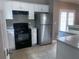 Kitchen features white cabinets, modern appliances, and plenty of counter space at 4415 Yates Rd, Atlanta, GA 30337