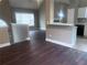 Open-concept living space features hardwood floors, access to the kitchen, and abundant natural light at 4415 Yates Rd, Atlanta, GA 30337