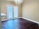 Living room with hardwood floors, high ceilings, French doors, and plenty of natural light at 4415 Yates Rd, Atlanta, GA 30337
