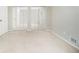 Neutral bedroom with mirrored closet doors and plush carpeting creates a serene, spacious feel at 6437 Stone Way, Morrow, GA 30260